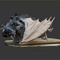 Artistic Dragon Character Sculpture With Detailed Textured Wings Lying On Book Platform