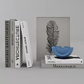 Collection of Books Including Furniture Design Architecture Titles With Feather Artwork And Blue Decor