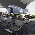 Outdoor Restaurant Seating Area With Trees Umbrella Stone Steps And Greenery