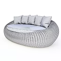 Modern Outdoor Sofa Round Woven Rattan Design with Light Colored Seat Cushions