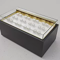 Display Showcase Shelf With Transparent Glass Top Black Base And Neatly Arranged Items Inside