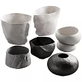 Modern Decorative Ceramic Vessels in Black and White with Various Shapes and Textured Surfaces