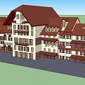 Multi Story Building Exterior With Red Roof White And Brown Walls And Windows