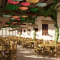 Chinese Restaurant Interior With Colorful Umbrella Pendant Lights Bamboo Lamps Green Vines And Wooden Tables