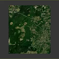 Aerial View of Lush Green Natural Landscape With Rolling Terrain and Vegetation