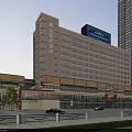 Modern High Rise Hotel Building With Light Beige Exterior Signboard And Shops At Bottom