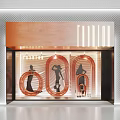 Elegant Copper Window Display With Curved Elements Silhouette Figures And Glass Lighting