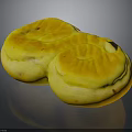 Two Golden Yellow Round Pastries With Shiny Surface And Tasty Filling