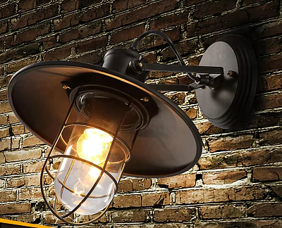Industrial Style Metal Wall Lamp with Black Shade and Warm Glowing Light on Brick Wall 3d model