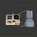 Vintage Medical Device with Display Screen Buttons and Silver Metallic Cylindrical Component Connected by Wires