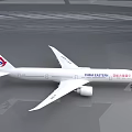 China Eastern Passenger Plane With White Body Red And Blue Logo On Reflective Ground