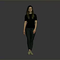 Woman in Black Top and Dark Pants with Green Shoes Standing Against Gray Background