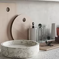 Stylish Kitchenware Collection with Marble Bowl Wooden Board Glass Bottles Metal Canisters on Light Countertop