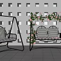 Outdoor Swing Chair With Metal Frame Checkered Cushions And Floral Vines In Patio