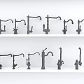 Multiple Black Faucets With Various Designs And Styles On White Shelves