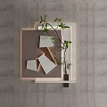 Modern Minimalist Wall Decor With Geometric Shapes And Green Foliage On Gray Wall