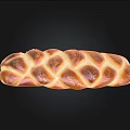 Golden Braided Bread With Shiny Crust And Soft Fluffy Texture