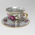 Vintage Porcelain Teacup And Saucer Set With Floral Pattern And Gold Trim