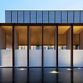 Modern Sales Office Building With Horizontal Glass Facade And Water Surface Reflection