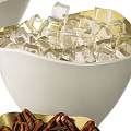 Party Treats With Champagne Glasses Wine Bottles Ice Buckets White Candies Nuts And Golden Chocolates