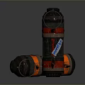 Cylindrical Weapon With Red And Black Stripes Standing And Lying Down With Igniter Label