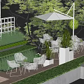 Outdoor Patio Table And Chair Set With Green Plants Trees And White Umbrella