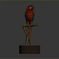 Vibrant Red Parrot with Green Wings Perched on Branch with Sand Base