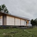 Modern Wooden House Exterior With Large Glass Windows Open Layout And Green Natural Surroundings