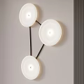 Three White Circular Wall Lamps with Black Brackets on Light Gray Wall and Dark Stripe