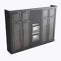 Dark Gray Wooden Kitchen Cabinets With Brass Handles And Built In Double Ovens