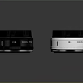 LUMIX Black And White Camera Lenses 25mm F1.7 ASPH Displayed On Reflective Surface