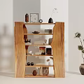 Wooden Display Cabinet With Open Shelves Holding Decorative Items Books And Ornaments