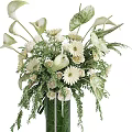 Elegant Floral and Greenery Decorative Arrangement with White Flowers Large Tropical Leaves and Brown Spikes