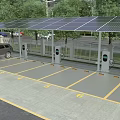Solar Panel Roof Parking Lot With Electric Vehicle Charging Stations Marked Spaces And Trees