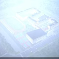 Modern School Building Complex With Sports Field Running Track Basketball Courts And Green Trees
