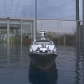 Modern Warship Floating on Water With Glass Buildings and Trees Background Displaying Number 888