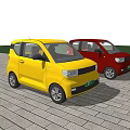 Yellow and Red Small Cars Parked on Brick Pavement With Green Trees