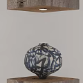 Blue and White Flower Vase With Black Abstract Patterns On Wooden Base Under Hanging Lighting