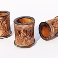 Three Carved Wooden Pen Holders With Intricate Patterns And Classic Design