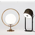 Two Modern Table Lamps Featuring Circular Frame And Tilted Lampshade Design