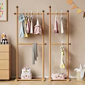 Wooden Storage Cabinet in Kids Room with Stuffed Toys Wooden Hanger and Alphabet Wall Decor