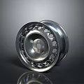 Silver Tire's Wheel Rim Featuring Multiple Circular Holes And Reflective Finish On Dark Background