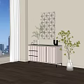 White Console Cabinet with Drawers Gold Trim Potted Plants and Textured Wall Art