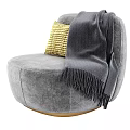 Gray Velvet Single Sofa with Yellow Woven Pillow and Gray Fringed Blanket on Golden Base