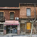 Urban Building Complex With Red Brick Buildings Bakery Pastry Shop Sign Windows Shutters Yellow Doors