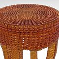 Brown Woven Stool With Spiral Texture And Unique Curved Legs Design