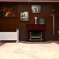 Vintage Room Interior Featuring Wooden Walls Paintings White Baby Bed Fireplace Cross Sword Chair Rugs