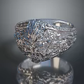 Silver Ornate Ring with Intricate Floral Patterns on Smooth Reflective Surface