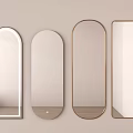 Various Shapes of Decorative Mirrors Hanging on Light Colored Interior Wall