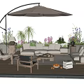 Outdoor Sofa With Beige Umbrella Patio Coffee Table And Lush Plants In Garden Area